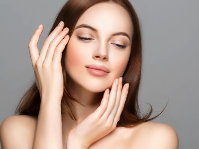 Woman beauty clean healthy skin manicure nails hands touching face cosmetic spa